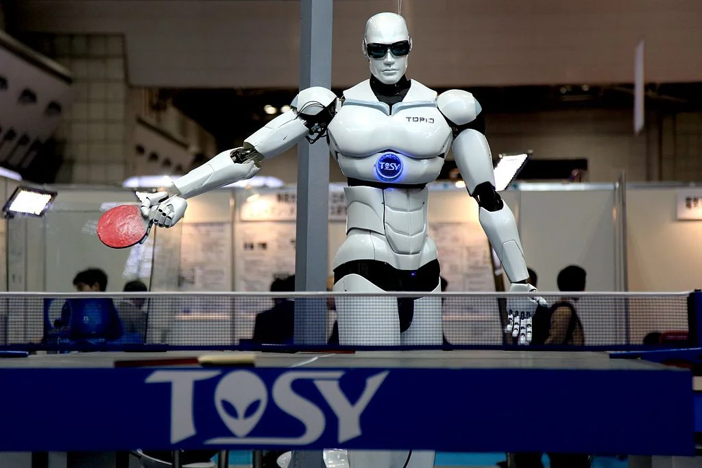 Humanoid robot playing table tennis at a technology exhibition