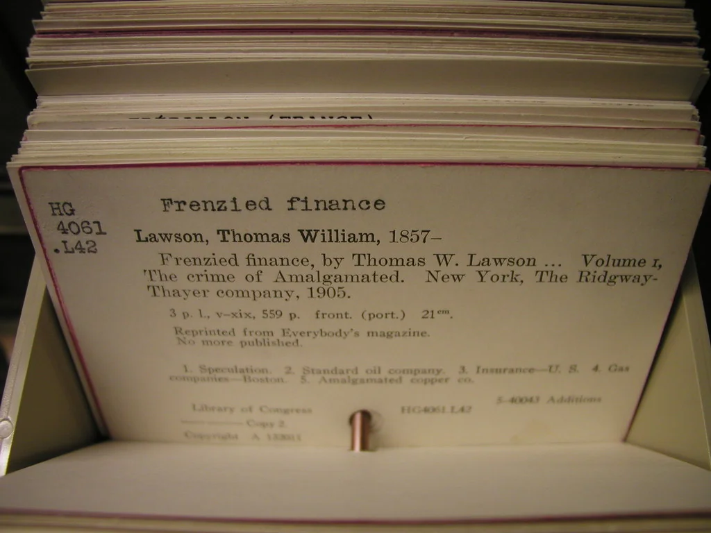 Library catalog card summarizing a book in a card drawer